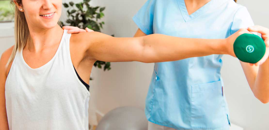 A Modern rehabilitation physiotherapist at work with client